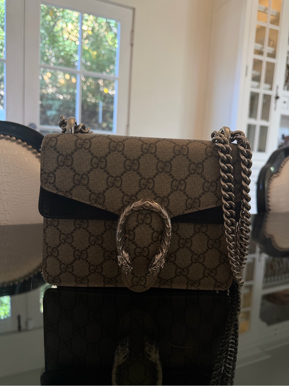 Gucci beige GG Supreme canvas crossbody with black trim and silver hardware